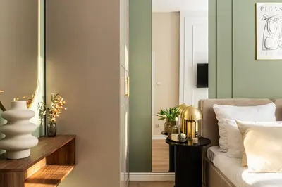 a dining room with a table and a mirror at Perfect Apartment in the Old Town 5min Market Square AC WiFi Parking in Kraków