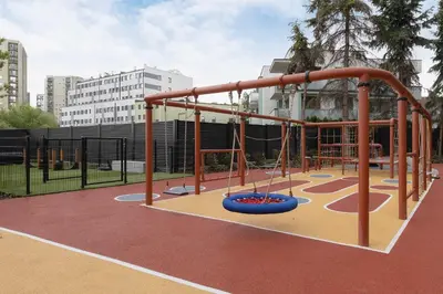 a playground in a park with a monkey troop at Stylish Apartment with Underground Parking Located Near the TAURON Arena by Noclegi Renters in Kraków
