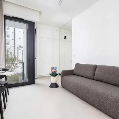 Stylish Apartment with Underground Parking Located Near the TAURON Arena by Noclegi Renters