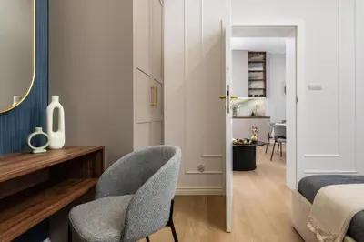 a dining room with a table and a room with a bed at Old Town 5min Main Market Square Perfect Apartment AC WiFi Parking Balcony in Kraków