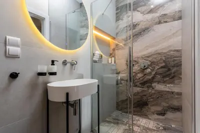 a bathroom with a sink and a shower at Old Town 5min Main Market Square Perfect Apartment AC WiFi Parking Balcony in Kraków
