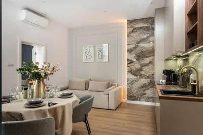 a bathroom with a sink and a mirror at Old Town 5min Main Market Square Perfect Apartment AC WiFi Parking Balcony in Kraków
