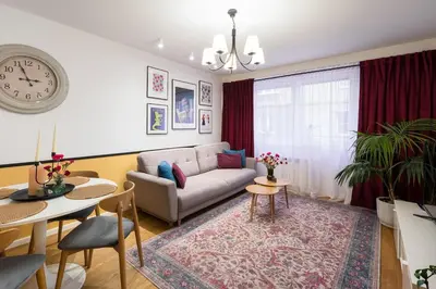 a living room with a couch and a table at Tomasza 25 Apartment 2 in Kraków
