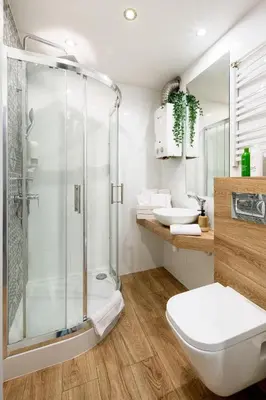 a bathroom with a shower and a toilet and a sink at Tomasza 25 Apartment 2 in Kraków