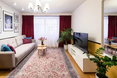 a living room with a couch and a tv at Tomasza 25 Apartment 2 in Kraków