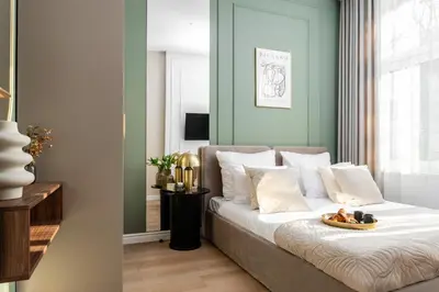 a bedroom with a bed with a tray of food on it at 2x Perfect Apartment OLD TOWN 5min Main Market Square AC WiFi Parking Balcony in Kraków