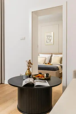 a living room with a coffee table and a bed at 2x Perfect Apartment OLD TOWN 5min Main Market Square AC WiFi Parking Balcony in Kraków