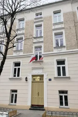 a white building with a door and an umbrella at 2x Perfect Apartment OLD TOWN 5min Main Market Square AC WiFi Parking Balcony in Kraków