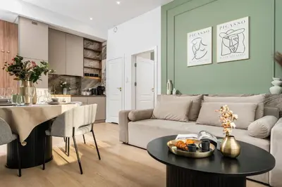 a kitchen and dining room with a table and chairs at 2x Perfect Apartment OLD TOWN 5min Main Market Square AC WiFi Parking Balcony in Kraków