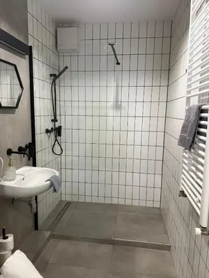 a bathroom with a shower and a sink at Golden Honey Apartment- Studio Cracow Old Town in Kraków