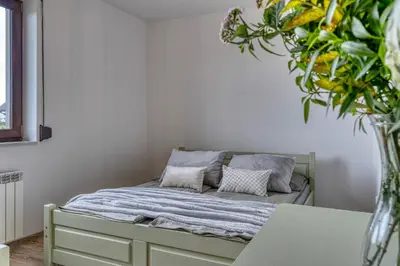 a bed with two pillows on it in a room at La Nostra Villa in Zator