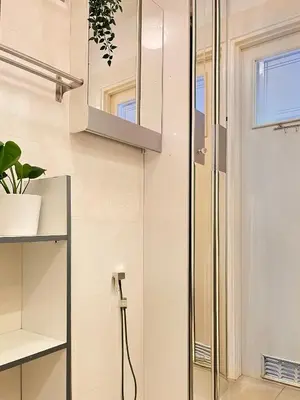 a shower with a glass door in a bathroom at Apartment for 7 guests in the city of Cracow in Kraków