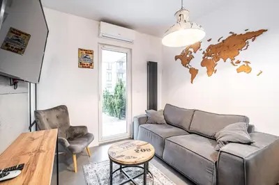 a living room with a couch and a table at RentPlanet - Apartament Rakowicka in Kraków