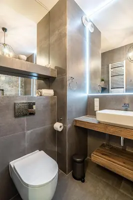 a bathroom with a toilet and a sink at RentPlanet - Apartament Rakowicka in Kraków