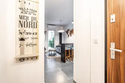 two views of a living room and a dining room at RentPlanet - Apartament Rakowicka in Kraków