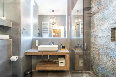 a bathroom with a sink and a shower at RentPlanet - Apartament Rakowicka in Kraków