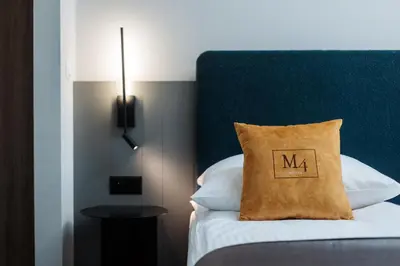 a bathroom with a sink and a mirror at Hotel M4 Boutique in Kraków
