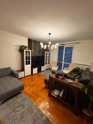a living room with a couch and a table at The Nest, Apartament in Oświęcim