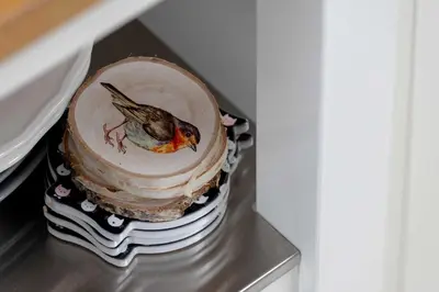a cake in a refrigerator with a bird on it at Bright Apartment in Kraków Perfect for Remote Work by Noclegi Renters in Kraków