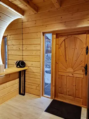 a room with a wooden door in a cabin at Domek Jaworówka in Zawoja