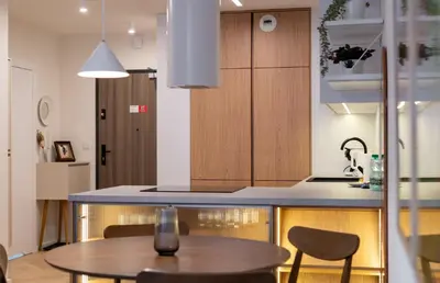 a kitchen with a table and a counter top at Prokocim Superior Apartment by BookingHost in Kraków