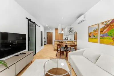 a living room with a couch and a table at Prokocim Superior Apartment by BookingHost in Kraków