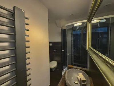 a bathroom with a sink and a toilet at Stylish 1BR for 4 in Old Town - Main Square in Kraków