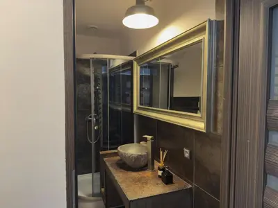a bathroom with a sink and a mirror at Stylish 1BR for 4 in Old Town - Main Square in Kraków