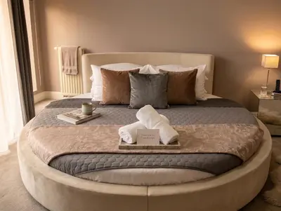 a bedroom with a large bed with a large window at Kings City Szlak 77 55sqm Round Bed 230cm Two Balconies in Kraków
