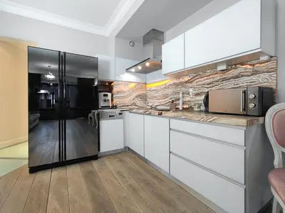 a towel and a bottle on a counter with a towel at Kings City Szlak 77 55sqm Round Bed 230cm Two Balconies in Kraków