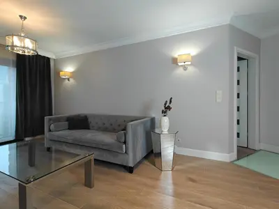 a large bed with many pillows on it at Kings City Szlak 77 55sqm Round Bed 230cm Two Balconies in Kraków