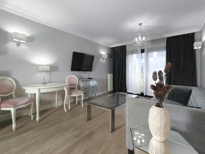 a group of four red and brown tags on a rock at Kings City Szlak 77 55sqm Round Bed 230cm Two Balconies in Kraków