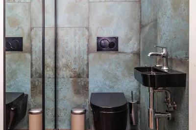 a bathroom with a sink and a toilet at 4 Bedroom apartment with a balcony - Trynitarska 6 in Kraków