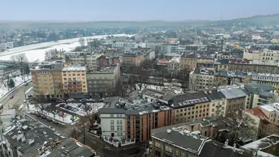 an aerial view of a city in the snow at Wawel Kossak Residence Loft Studio by BookingHost in Kraków
