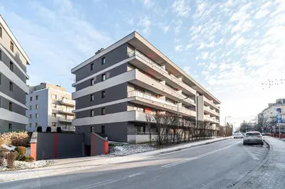 an apartment building on the side of a street at RentPlanet - Apartament Rydlówka in Kraków