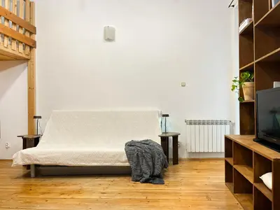 a bedroom with a bed with two towels on it at Apartment for 4 guests in historic Cracow Podgórze in Kraków
