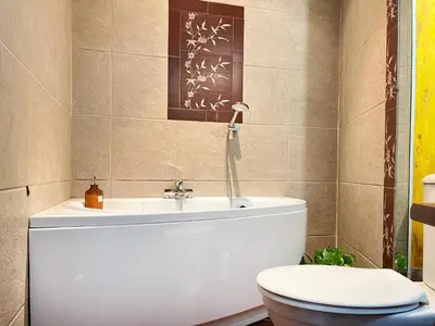 a bathroom with a toilet and a sink at Apartment for 4 guests in historic Cracow Podgórze in Kraków