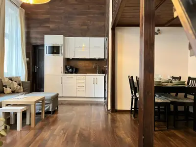 a living room with a couch and a table at Beautiful Studio for 4 guests, Main Square, Cracow in Kraków