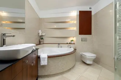 a bathroom with a tub and a sink and a toilet at Family Two-Level Apartment with Air Conditioning by Noclegi Renters in Kraków