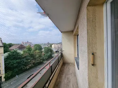 a balcony of a building with a view of a street at mieszkanie z widokiem na Wawel in Kraków