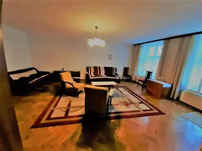 a living room with a couch and chairs at Let's go back to the memories in Kraków