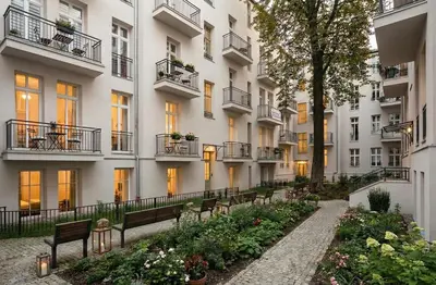 a row of buildings with benches in a courtyard at Dodo Acomodo 10 - Kazimierz, Vintage - High Ceilings - Near Station in Kraków