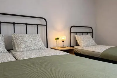 a room with two sliding doors and a room with a table at Apartament Paoli 2 in Zator