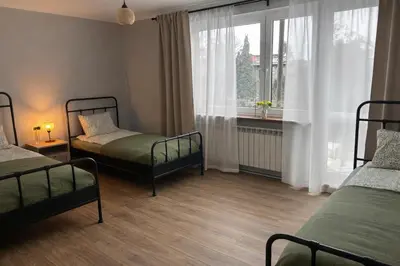 a bathroom with a white sink and a mirror at Apartament Paoli 2 in Zator