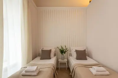 a living room with a table and a dining room at Old Town św Jana by Downtown Apartments in Kraków
