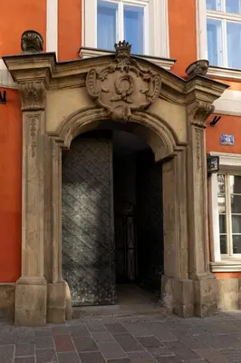 a kitchen with white cabinets and a sink at Old Town św Jana by Downtown Apartments in Kraków