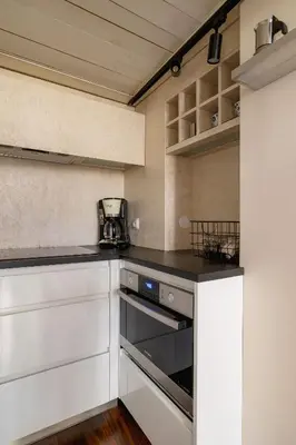 a kitchen with white cabinets and a stove at 2 bedroom apartment - Grodzka Street - City Center in Kraków
