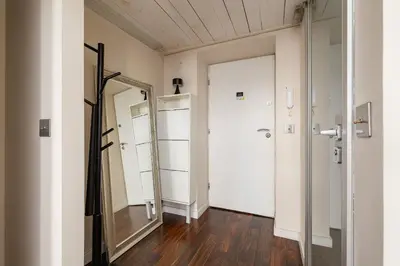 a dressing room with a mirror and a closet at 2 bedroom apartment - Grodzka Street - City Center in Kraków