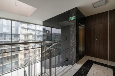 an elevator in a building with a balcony at Tasteful Apartment in Cracow with Parking & Balcony by Nolcegi Renters in Kraków