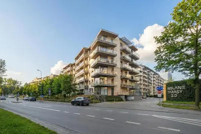 a building on the side of a city street at Tasteful Apartment in Cracow with Parking & Balcony by Nolcegi Renters in Kraków